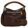 👜